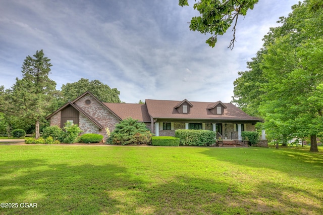 1330 Stoneledge Ln, Neosho, MO 64850 - cape cod house featuring a front lawn, a porch, and brick siding