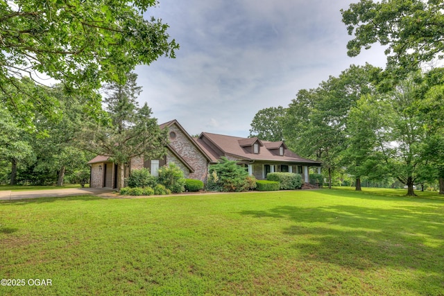 1330 Stoneledge Ln, Neosho, MO 64850 - view of front of property featuring stone siding, driveway, a front lawn, and an attached garage