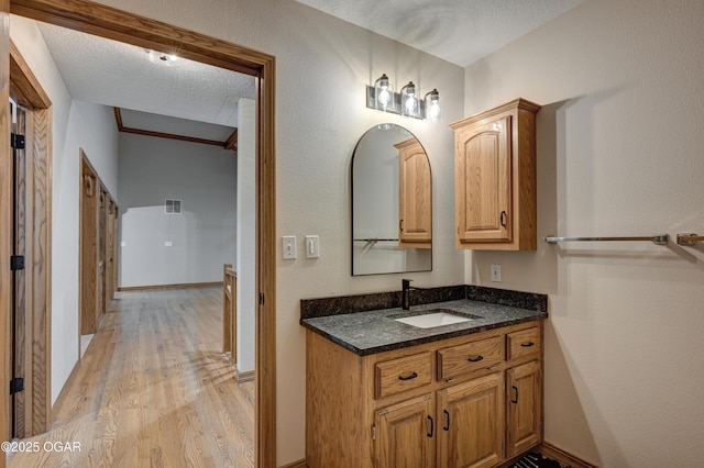 1330 Stoneledge Ln, Neosho, MO 64850 - bathroom featuring wood finished floors, vanity, and baseboards