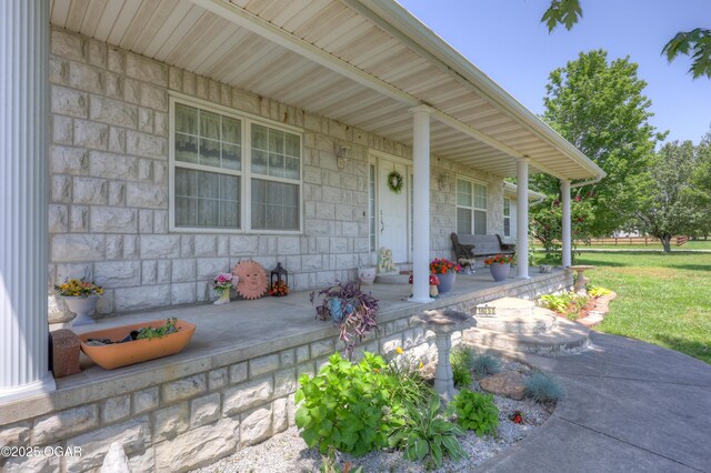 16050 Alford Ln, Diamond, MO 64840 - view of exterior entry with a porch and stone siding