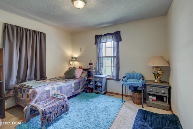 16050 Alford Ln, Diamond, MO 64840 - carpeted bedroom with a textured ceiling and baseboards