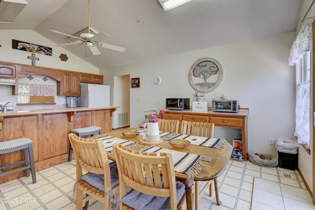 16050 Alford Ln, Diamond, MO 64840 - dining room with lofted ceiling, ceiling fan, and light flooring