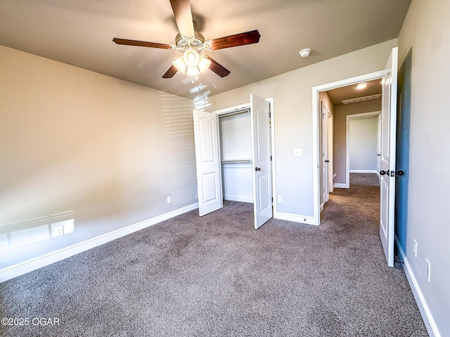 815 Delaney Dr, Carl Junction, MO 64834 - unfurnished bedroom with dark carpet, a ceiling fan, and a closet