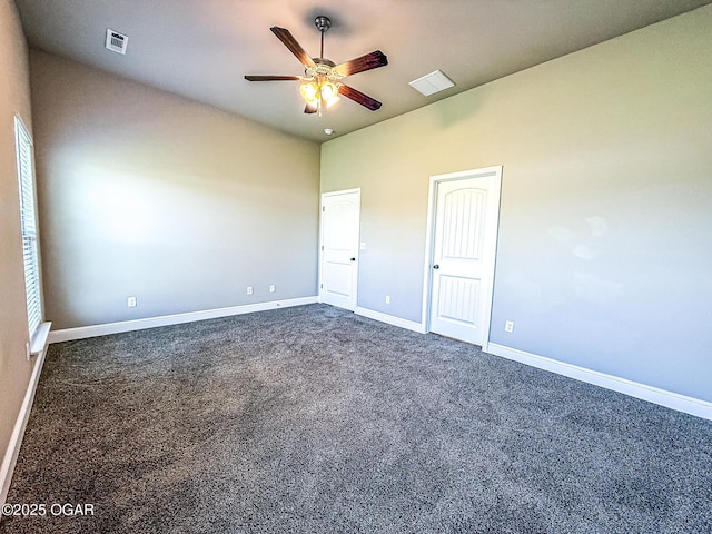 815 Delaney Dr, Carl Junction, MO 64834 - spare room with a ceiling fan, dark carpet, and vaulted ceiling