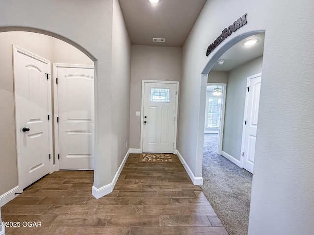 815 Delaney Dr, Carl Junction, MO 64834 - foyer entrance featuring arched walkways and wood finished floors