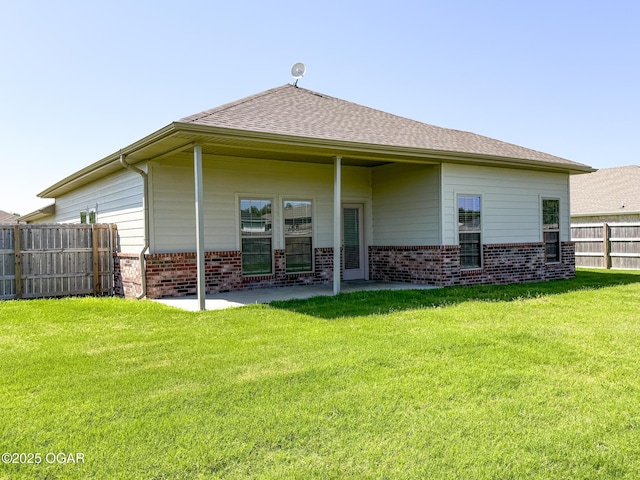 815 Delaney Dr, Carl Junction, MO 64834 - back of house with brick siding and a patio