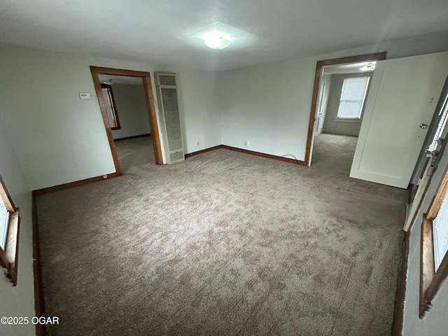421 N Webb St, Webb City, MO 64870 - unfurnished room featuring a heating unit, carpet flooring, and baseboards