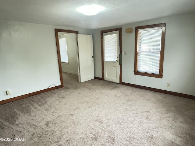421 N Webb St, Webb City, MO 64870 - carpeted empty room featuring healthy amount of natural light and baseboards