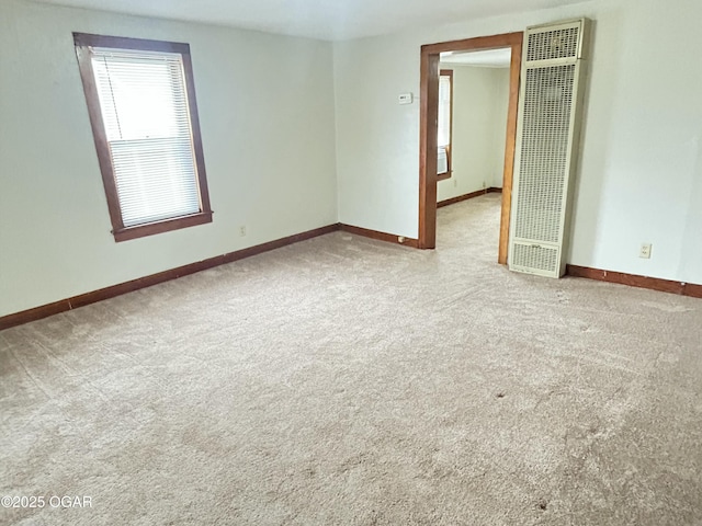 421 N Webb St, Webb City, MO 64870 - carpeted spare room with a heating unit and baseboards