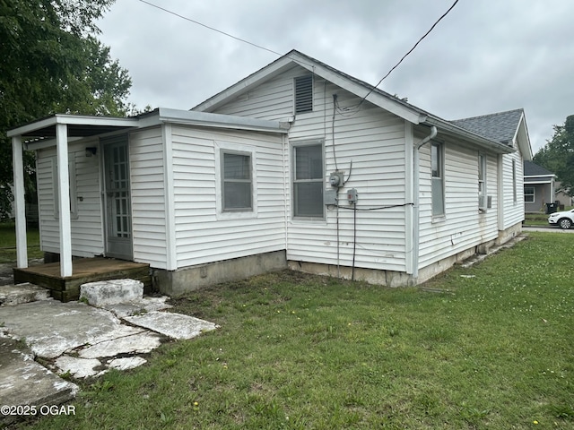 421 N Webb St, Webb City, MO 64870 - view of side of property with a lawn and roof with shingles