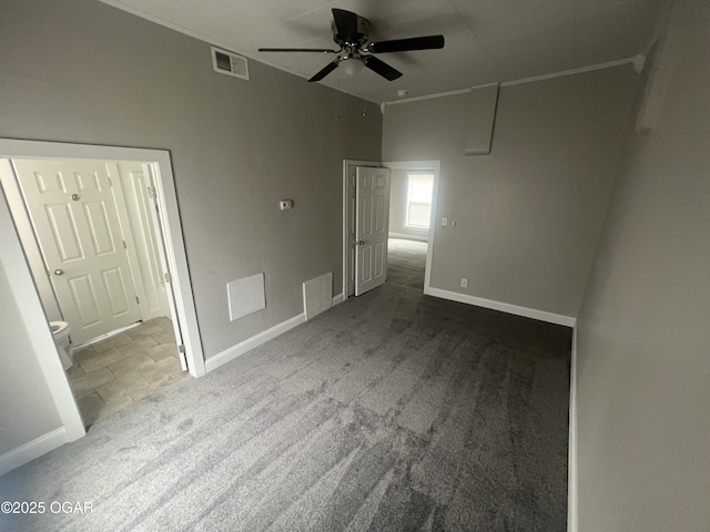 1816 S Connor Ave, Joplin, MO 64804 - unfurnished bedroom featuring baseboards, carpet floors, ceiling fan, and stone finish floors