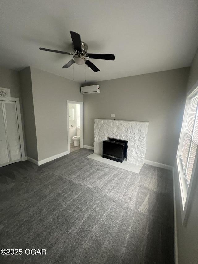 1816 S Connor Ave, Joplin, MO 64804 - unfurnished living room featuring an AC wall unit, dark colored carpet, ceiling fan, and baseboards