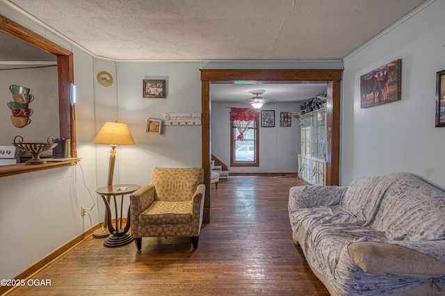 17279 Jackpine Rd, Carthage, MO 64836 - living area featuring hardwood / wood-style floors, baseboards, a textured ceiling, stairway, and ornamental molding