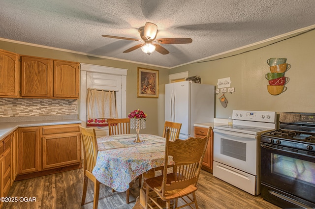 17279 Jackpine Rd, Carthage, MO 64836 - kitchen featuring white appliances, wood finished floors, a ceiling fan, light countertops, and a textured ceiling