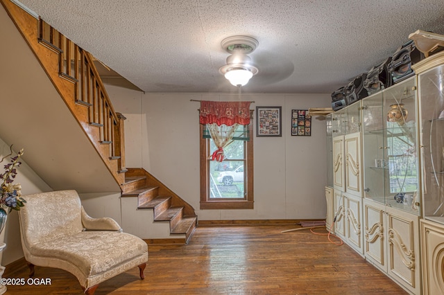 17279 Jackpine Rd, Carthage, MO 64836 - foyer with a textured ceiling, stairs, hardwood / wood-style floors, baseboards, and ceiling fan