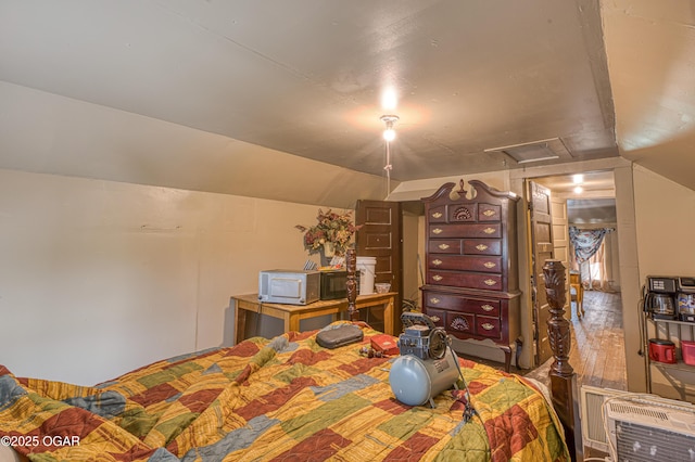 17279 Jackpine Rd, Carthage, MO 64836 - bedroom with vaulted ceiling, heating unit, and attic access