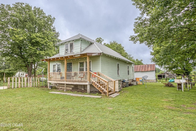 17279 Jackpine Rd, Carthage, MO 64836 - back of house with metal roof and a porch
