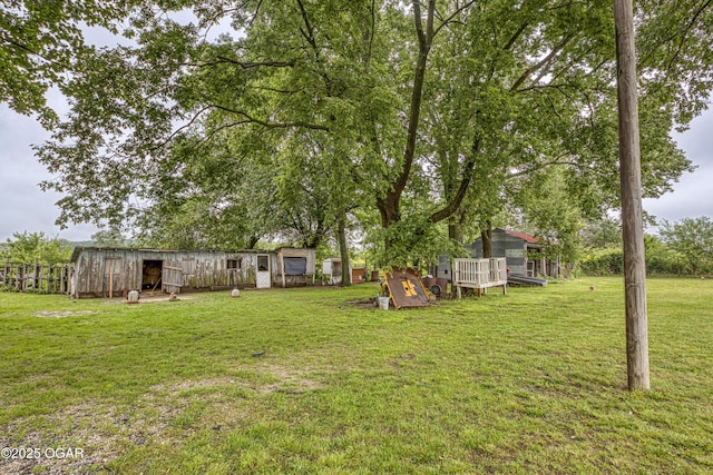 17279 Jackpine Rd, Carthage, MO 64836 - view of green lawn with an outbuilding