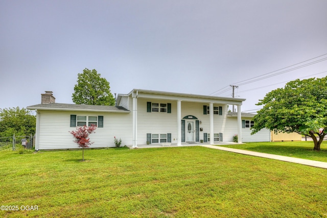 2521 Wisconsin Ave, Joplin, MO 64804 - split foyer home featuring a chimney and a patio