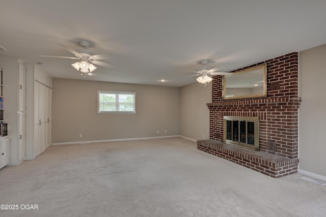 2521 Wisconsin Ave, Joplin, MO 64804 - unfurnished living room with ceiling fan, carpet floors, a brick fireplace, and baseboards