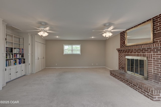 2521 Wisconsin Ave, Joplin, MO 64804 - unfurnished living room featuring a ceiling fan, carpet flooring, a fireplace, and baseboards
