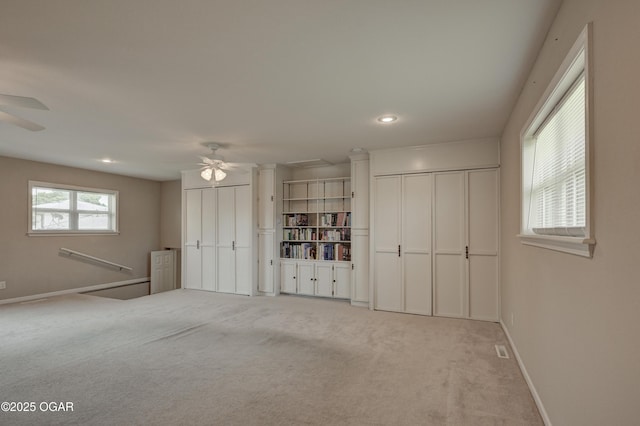 2521 Wisconsin Ave, Joplin, MO 64804 - unfurnished bedroom with multiple closets, light colored carpet, baseboards, recessed lighting, and ceiling fan