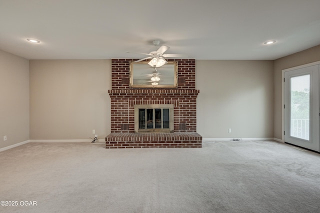 2521 Wisconsin Ave, Joplin, MO 64804 - unfurnished living room featuring ceiling fan, carpet floors, baseboards, a fireplace, and recessed lighting
