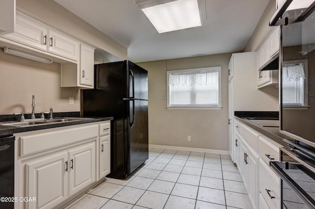 2521 Wisconsin Ave, Joplin, MO 64804 - kitchen featuring a sink, black appliances, white cabinetry, and dark countertops
