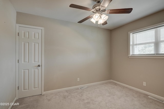 2521 Wisconsin Ave, Joplin, MO 64804 - empty room featuring a ceiling fan, carpet, and baseboards