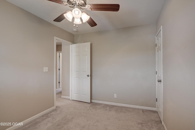 2521 Wisconsin Ave, Joplin, MO 64804 - spare room featuring light carpet, ceiling fan, and baseboards