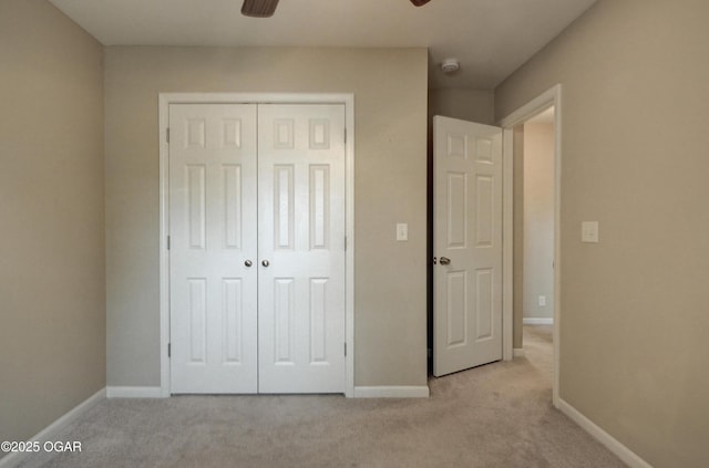 2521 Wisconsin Ave, Joplin, MO 64804 - unfurnished bedroom featuring a closet, carpet, baseboards, and ceiling fan