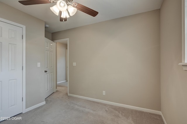 2521 Wisconsin Ave, Joplin, MO 64804 - unfurnished bedroom with light carpet, baseboards, and a ceiling fan