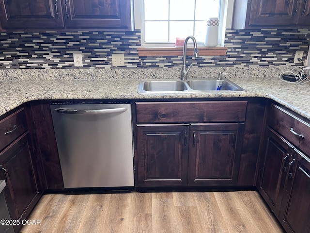 2038 W Trolley Car Ln, Carthage, MO 64836 - kitchen with stainless steel dishwasher, decorative backsplash, and light wood finished floors