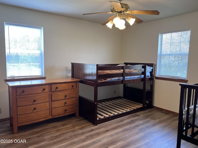 2038 W Trolley Car Ln, Carthage, MO 64836 - bedroom featuring wood finished floors and multiple windows