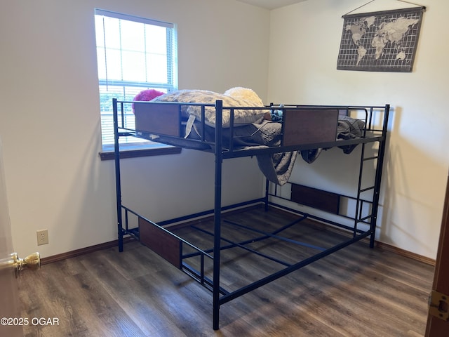 2038 W Trolley Car Ln, Carthage, MO 64836 - bedroom featuring wood finished floors and baseboards