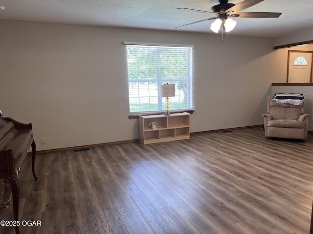 2038 W Trolley Car Ln, Carthage, MO 64836 - sitting room featuring ceiling fan, wood finished floors, and a textured ceiling