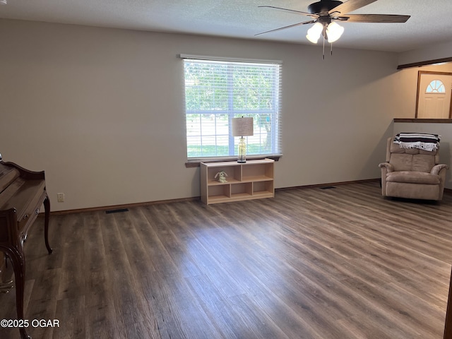 2038 W Trolley Car Ln, Carthage, MO 64836 - unfurnished room with wood finished floors, a ceiling fan, and healthy amount of natural light