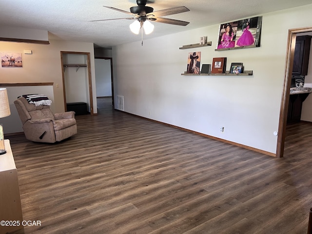 2038 W Trolley Car Ln, Carthage, MO 64836 - living room featuring ceiling fan, wood finished floors, and a textured ceiling
