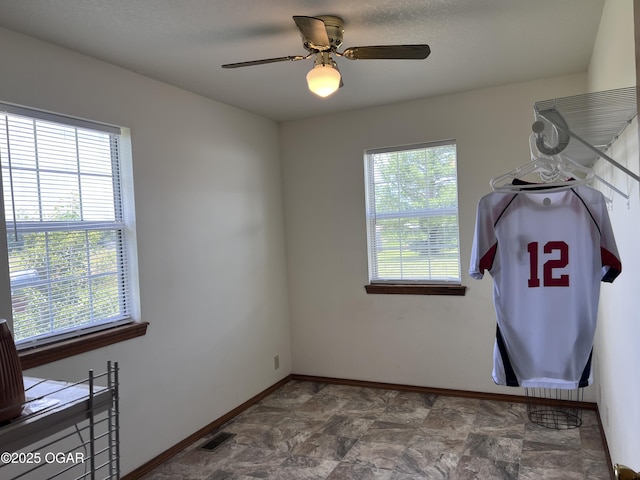 2038 W Trolley Car Ln, Carthage, MO 64836 - laundry area featuring baseboards and a ceiling fan
