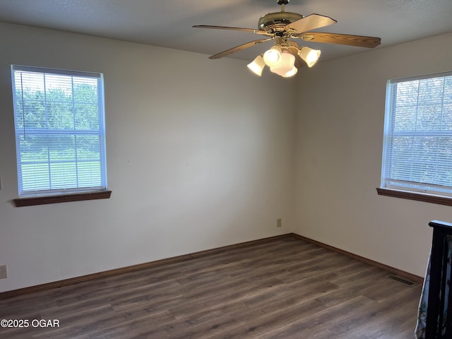 2038 W Trolley Car Ln, Carthage, MO 64836 - unfurnished room featuring dark wood finished floors and ceiling fan