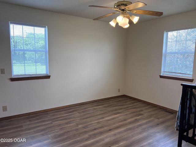 2038 W Trolley Car Ln, Carthage, MO 64836 - empty room with wood finished floors and a ceiling fan