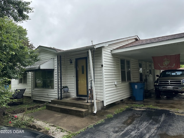 1003 Adams Ave, Seneca, MO 64865 - view of front of home with an attached carport and driveway