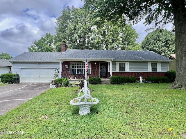 2511 E 28th St, Joplin, MO 64804 - ranch-style house with a chimney, an attached garage, concrete driveway, a front yard, and brick siding