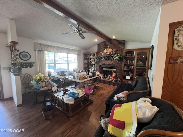 2511 E 28th St, Joplin, MO 64804 - living area featuring a textured ceiling, wood finished floors, ceiling fan, and a fireplace