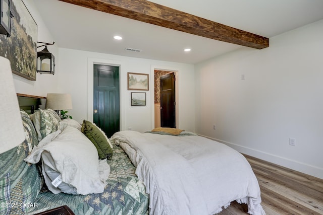 207 S Hall St, Webb City, MO 64870 - bedroom featuring wood finished floors, recessed lighting, baseboards, beam ceiling, and connected bathroom