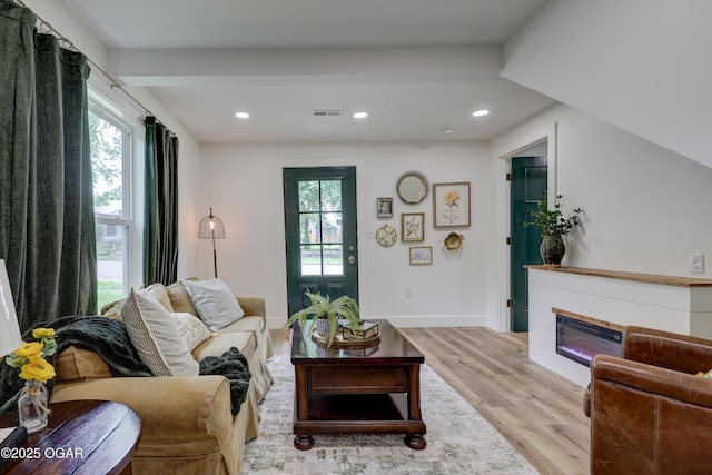 207 S Hall St, Webb City, MO 64870 - living room featuring light wood-style flooring, a glass covered fireplace, recessed lighting, and baseboards