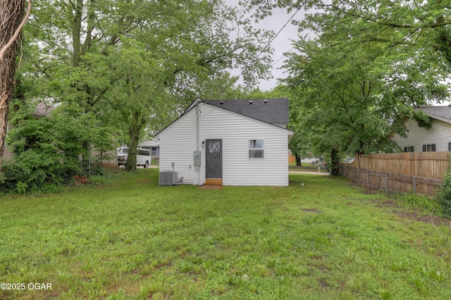 207 S Hall St, Webb City, MO 64870 - rear view of house with central AC and roof with shingles