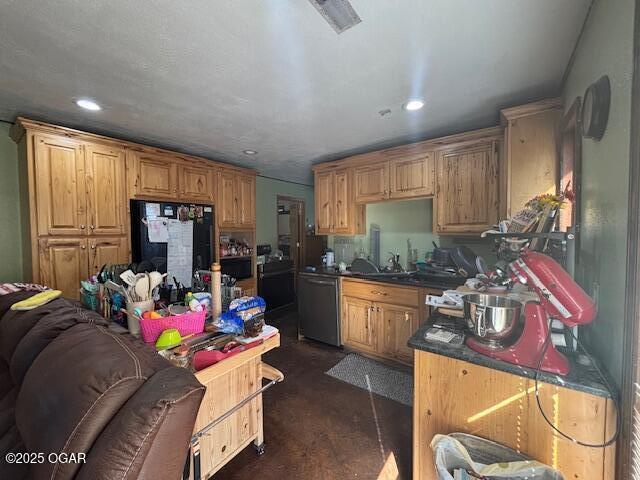 241 SE 40th Rd, Lamar, MO 64759 - kitchen featuring dishwasher, dark countertops, recessed lighting, concrete flooring, and refrigerator