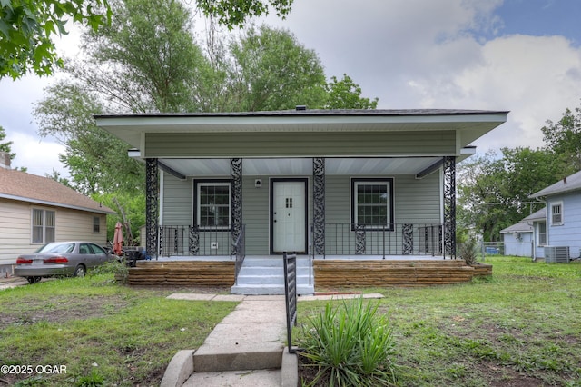 1917 S Murphy Ave, Joplin, MO 64804 - view of front facade featuring a porch, cooling unit, and a front yard