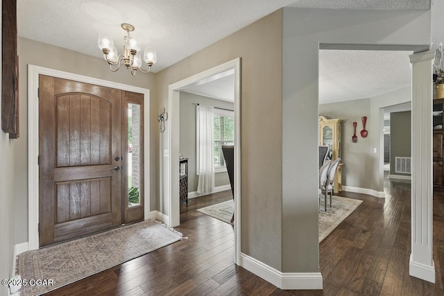 7870 County Lane 287, Carl Junction, MO 64834 - entryway featuring a textured ceiling, a chandelier, dark wood-style flooring, and baseboards